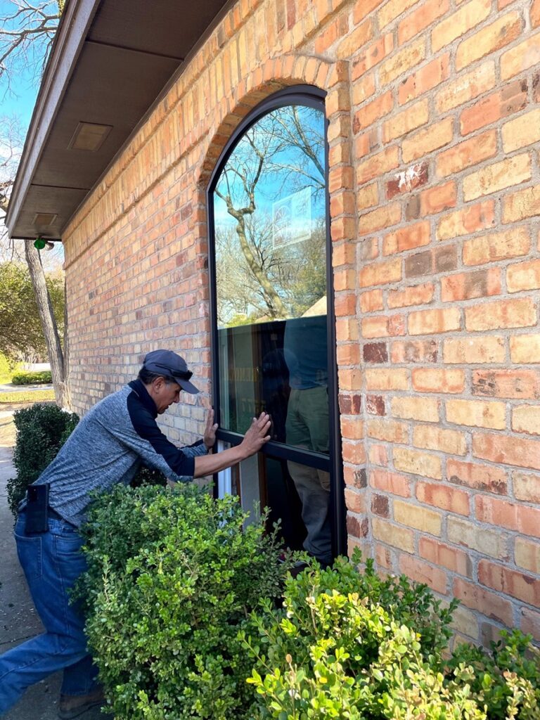 A-person-installing-home-energy-efficient-replacement-windows-in-palmetto-bay-fl